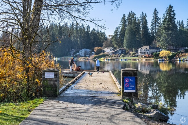 Locals gather at Cottage Lake Park to enjoy a crisp, sunny autumn afternoon.