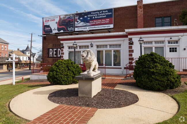A lion awaits and greets you in the Red Lion town center.