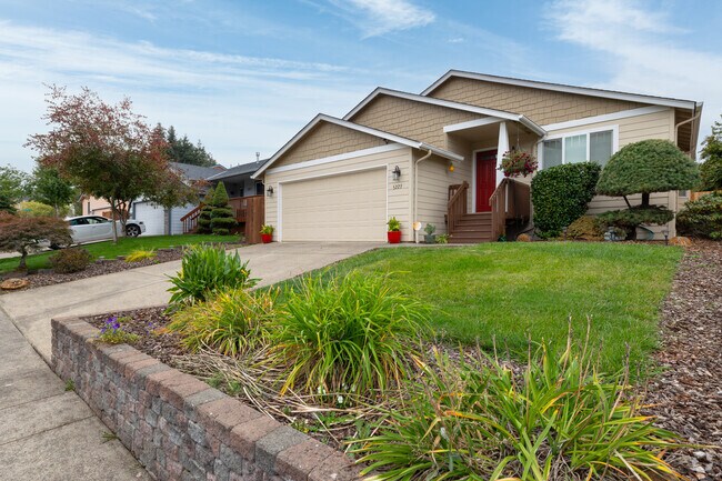 Perfectly manicured trees front a contemporary home on Mt Vernon St SE in South Gateway.