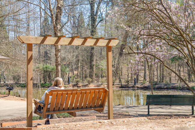Relax on one of the swinging benches boasting pond views at Newton Park in Newtown.