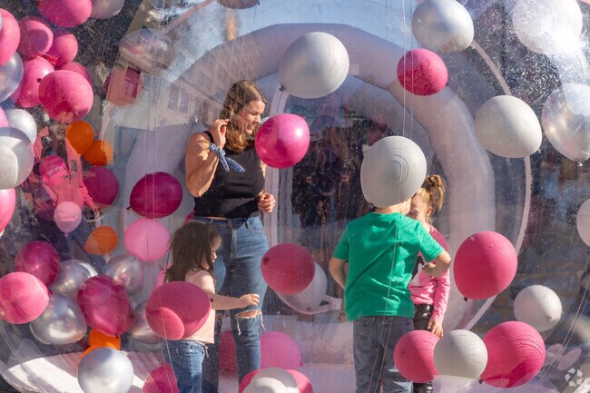 Families enjoy balloon-filled fun during the Terre Haute Night Market in downtown Terre Haute.