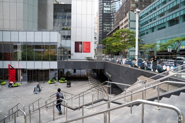 Stairs lead down to the subway interest in Midtown East.