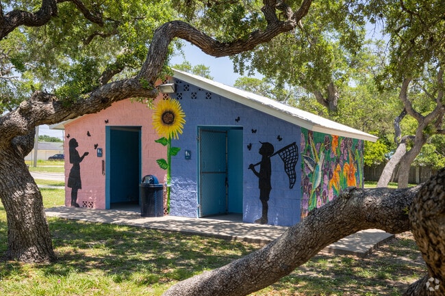 Visitors of all ages can explore around the sprawling trees at Newbury Park in Aransas Pass.