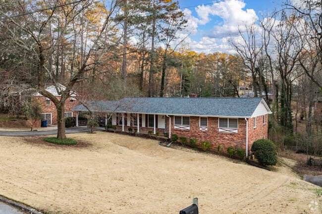 Arrowwood Drive’s homes sit far back from the road, often nestled on gentle hills that add to the neighborhood’s charm.