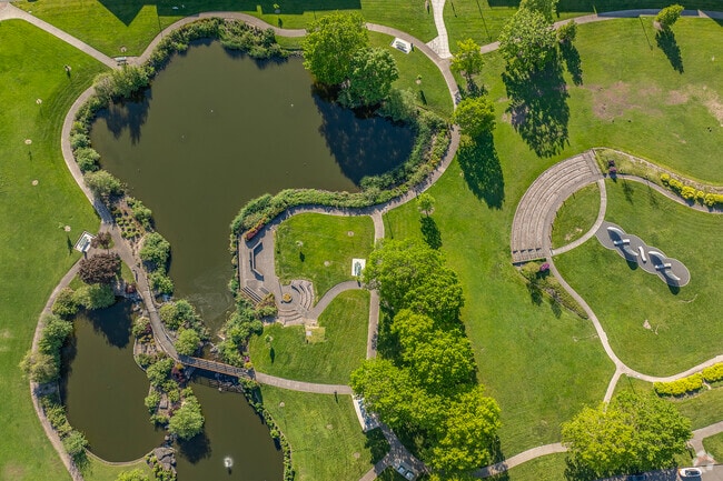 Amberglen Park features a relaxing pond and meditative sculpture.