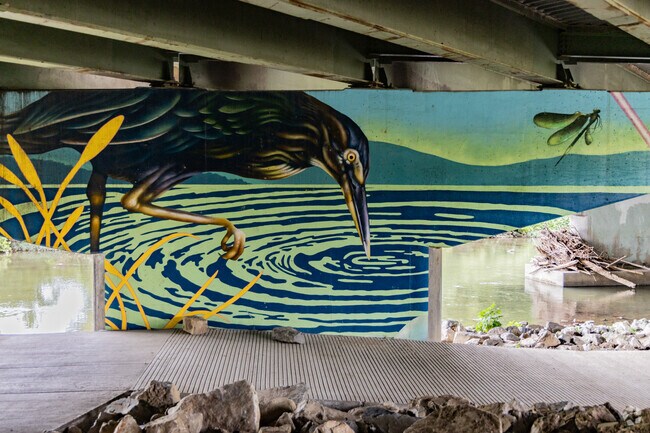 Large murals can be found down by the water at the Roanoke River Greenway.