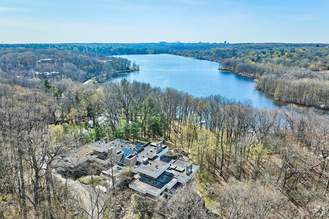 This massive modern home overlooks the north end of Barton Pond in Barton Hills.