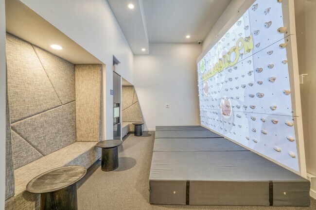 Rock climbing simulator with interactive games