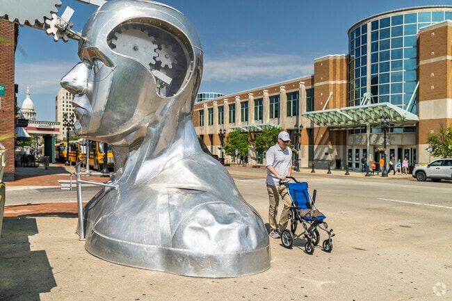 Foster offers public art, including the Portrait of a Dreamer sculpture, in downtown Lansing.