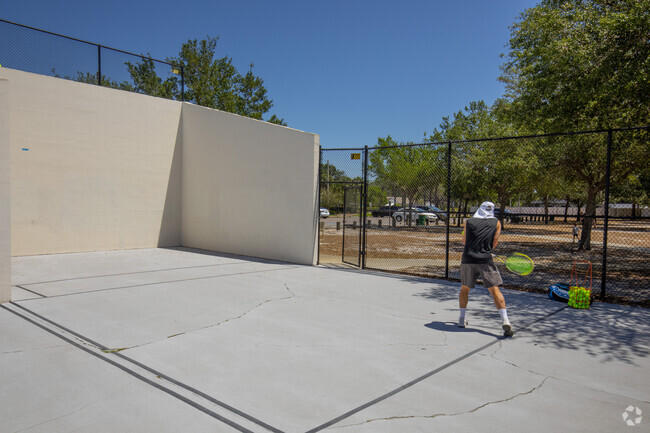 A player practices tennis at Bloomingdale Craftsman St Neighborhood Park in Bloomingdale, Florida.