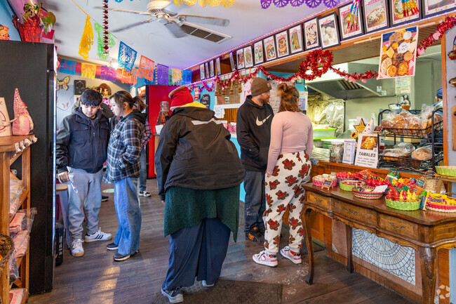 Locals gather at Coya’s Cafe, where bright walls and bold flavors bring East End to life.