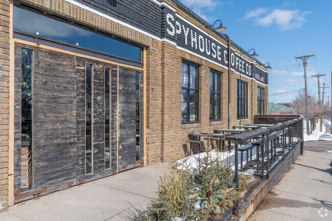 Spyhouse Coffee bustling cafe serving up house-roasted coffee and baked goods in a rustic venue.