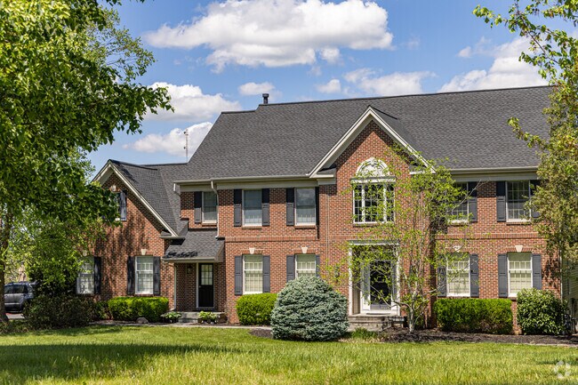 West Amwell homes feature steep roofs, brick facades, and colonial-style symmetry.