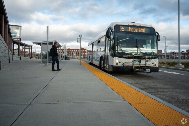 Bus riders waiting for their next bus at the Pawtucket-Central Falls bus station.