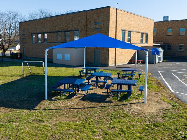 The students enjoy their time on the picnic tables.