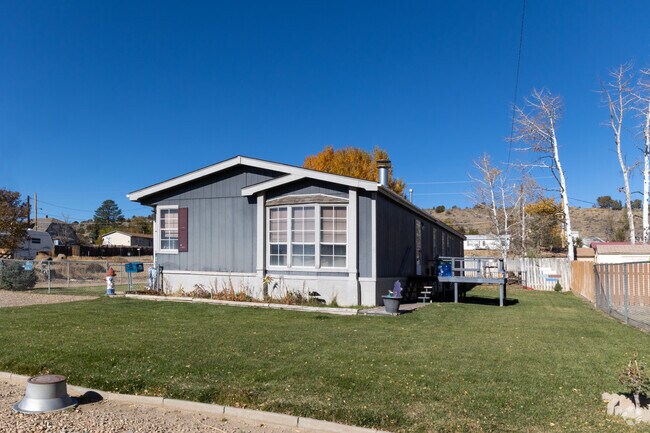 Fences and manicured lawns are features on some homes.