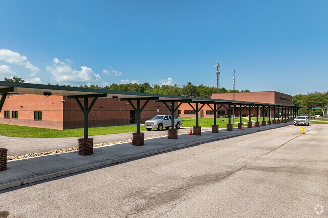 Students have a covered walk to the entrance of Carter Elementary School.