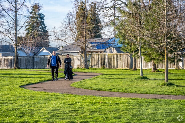 Northeast Salem residents take a peaceful morning stroll at scenic Weathers Street Park.