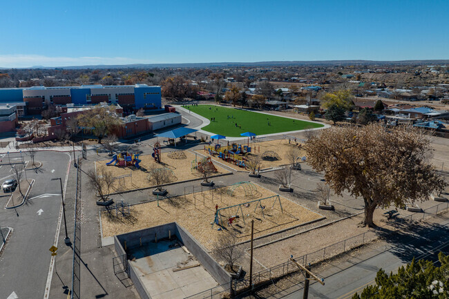 Playground and grass field at Atrisco Elementary School.