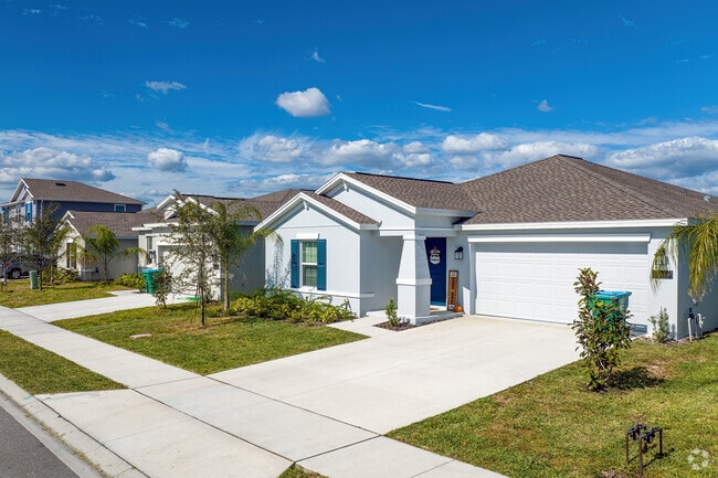 This row of homes in Osteen showcases well-maintained properties with pristine landscaping.