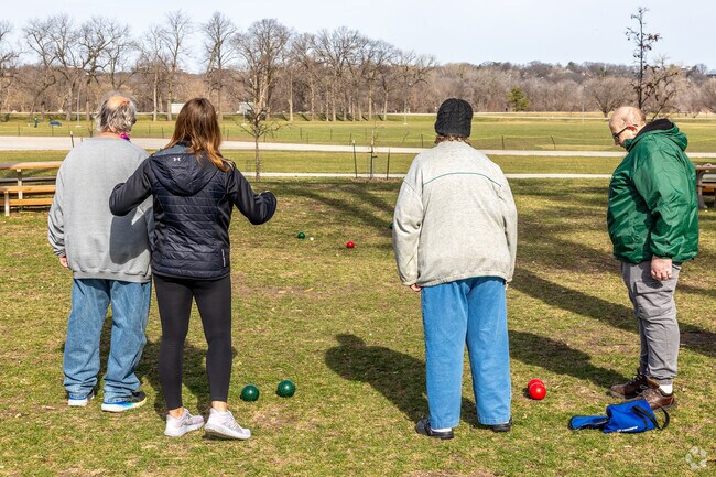 The expanse of Water Works Park offers green space, an amphitheater, and a natural playscape.