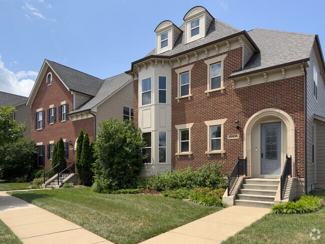 Beautiful brick luxury townhomes are a minute walk from One Loudoun's shopping district.