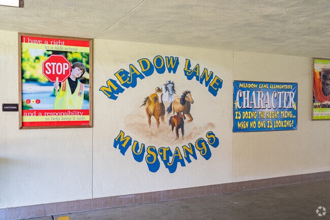 A large mural at Meadow Lane Elementary School features the school mascot.