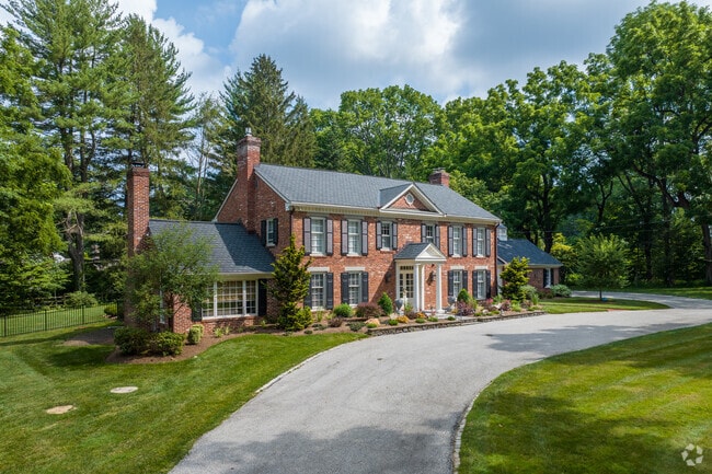 Large brick Colonial homes are common in the Newtown Square neighborhood.