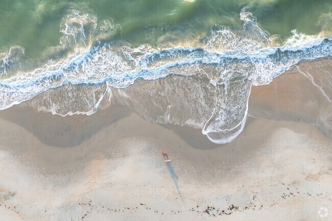 Litchfield Beach locals enjoy quiet dog walks along the water’s edge.