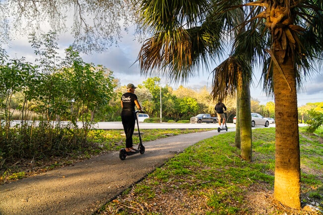 Cruise the neighborhood with joy on a scooter, savoring Renaissance Commons vibes.