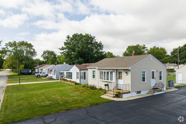A row of cape cod homes exude a welcoming atmosphere in the neighborhood of Winthrop Harbor, IL.