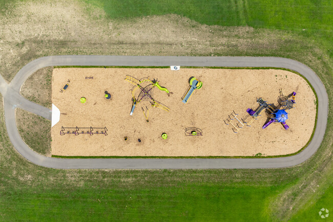 Concord Elementary School's playground features soft mulch for kids to run around on.