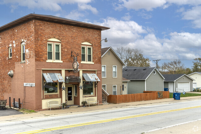 A historic brick stone building in Le Claire.