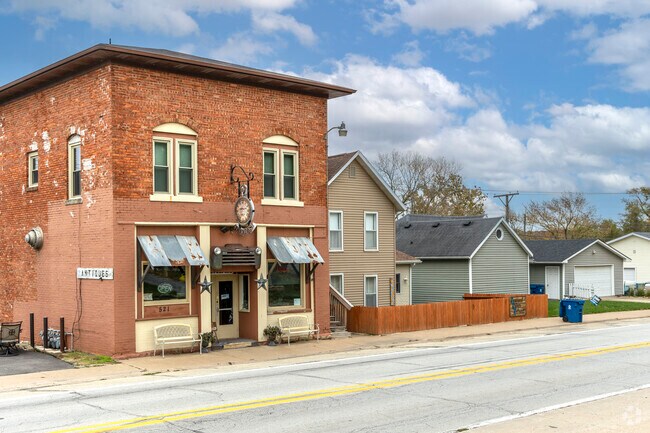 A historic brick stone building in Le Claire.