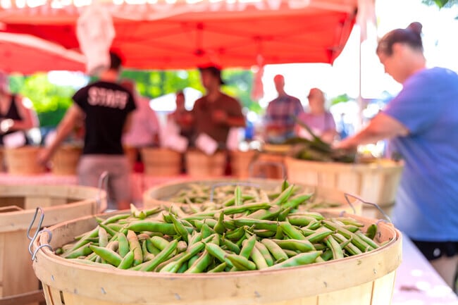 Vendors of Scott County Farmers Market offer fresh meats, eggs, and produce.