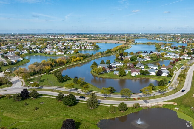 Enjoy the beautiful lakes and winding roads in Saddlebrook Farms in Round Lake Park.