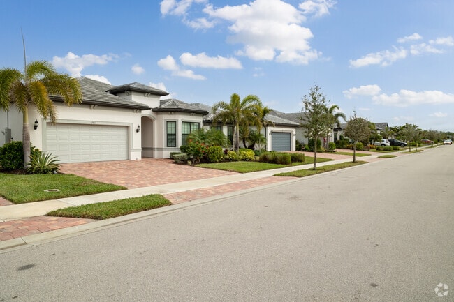 Lakeside homes in Winding Cypress line up along the shore.