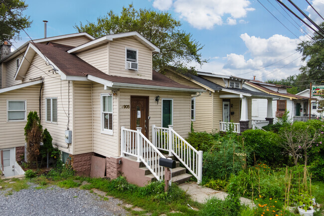 A row of beige bungalows line Tanglewood Drive in Edmonston.