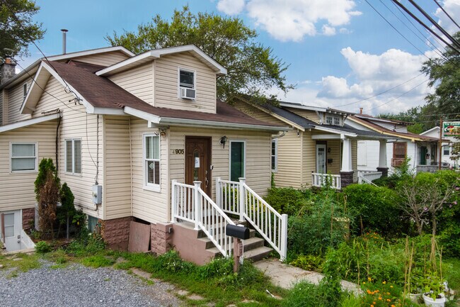 A row of beige bungalows line Tanglewood Drive in Edmonston.