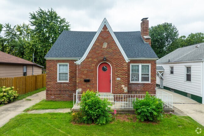 This unique brick cottage with a red door is an eye-catching property in Bunn Park.