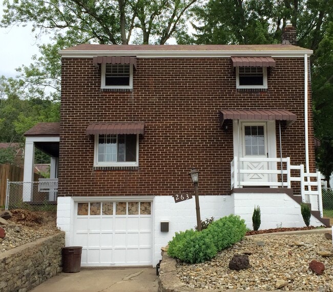 Charming all brick home and beautifully manicured fenced in yard in Penn Trafford School District. L