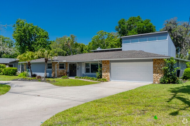 This split-level home is surrounded by mature trees which provide shade and privacy.