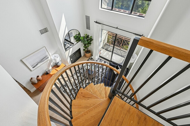 Bright and modern loft space with elegant spiral staircase