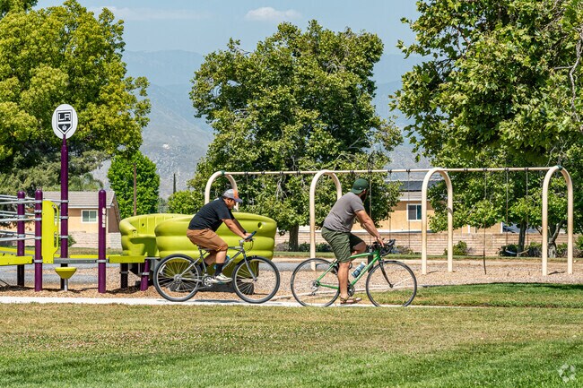 University residents enjoy a bike ride at the Lionel E. Hudson Park.
