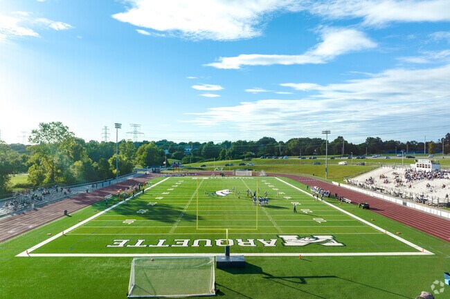 Football stadium surrounded by the track at Marquette Sr. High School.