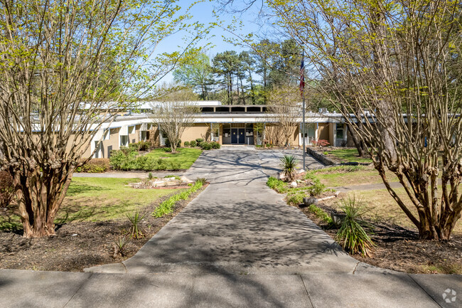 Margaret Harris Comprehensive School sits on a large treed lot.