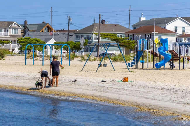 Play by the waves at Hankins Park’s sandy playground.