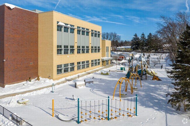 The rear of Badger Rock Middle School in Madison has modern playground equipment.