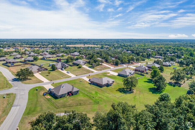 Many of the East Guthrie homes are surrounded by tall mature trees.