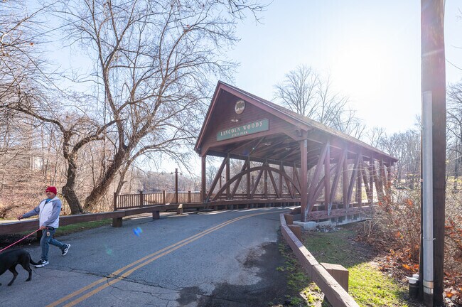 The covered bridge at Lincoln Woods State Park is a favorite spot for dog walkers near Berkeley.